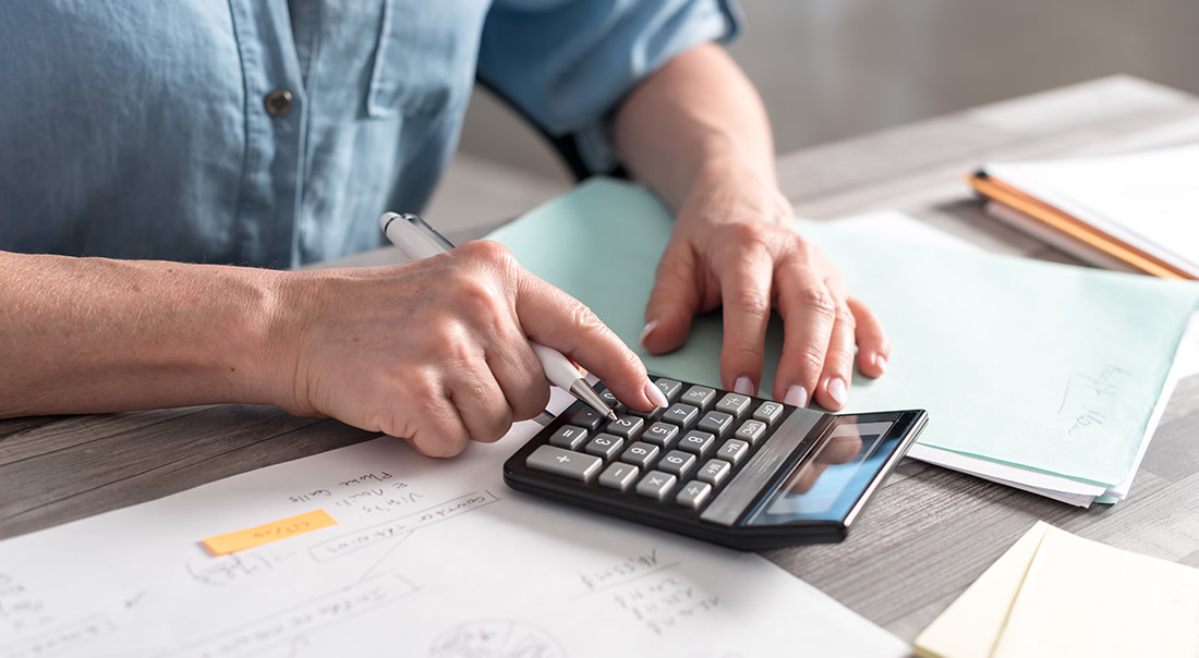 Image of a man using a calculator