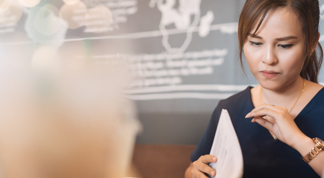 Picture of a lady looking through documents